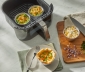2 air fryer cups sitting in an air fryer basket 