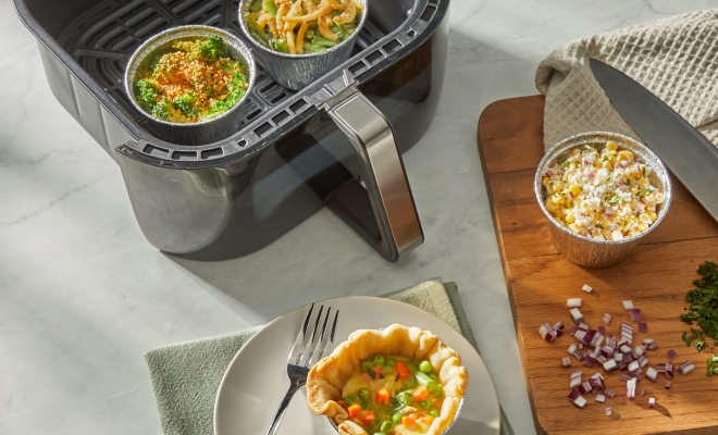 2 air fryer cups sitting in an air fryer basket 