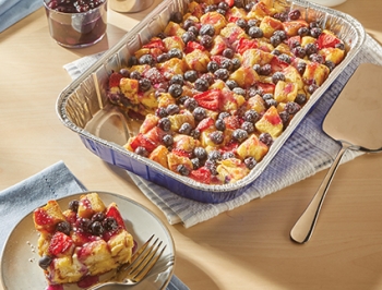 Blueberry French Toast in a disposable aluminum pan sitting on a wood table