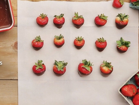 chocolate dipped strawberries on parchment paper