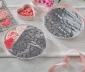Heart shaped cookies on a plate partially covered in Reynolds Wrap Fun Foil with embossed heart pattern