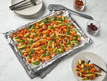 Roasted Sweet Potatoes and Brussels Sprouts with Cranberries and Pecans